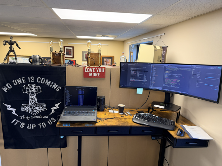 Operations workstation with dual monitors running code